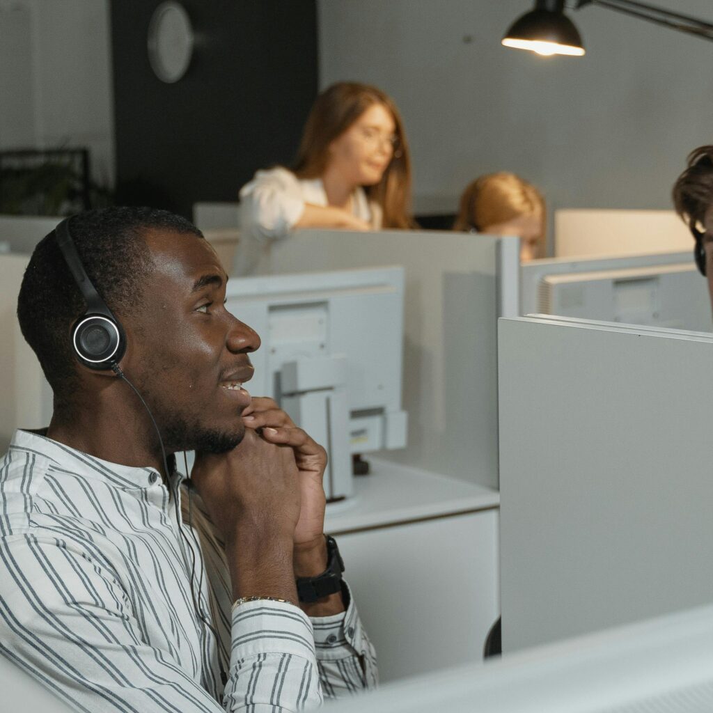 Call center team collaborating with headsets, providing efficient customer support.